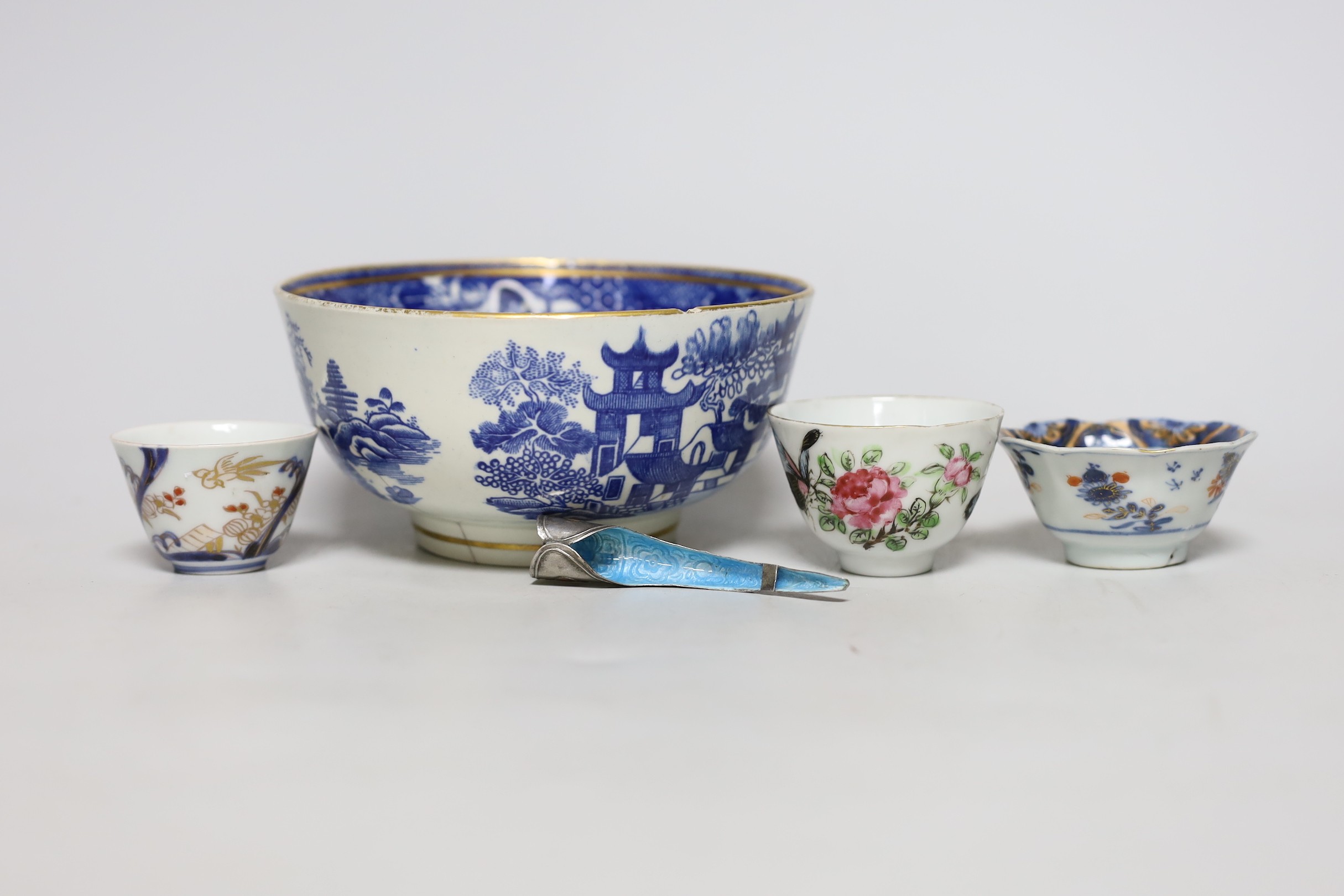 An English porcelain blue and white slop bowl, 15cm diameter, together with three miniature Chinese tea bowls and one nail guard